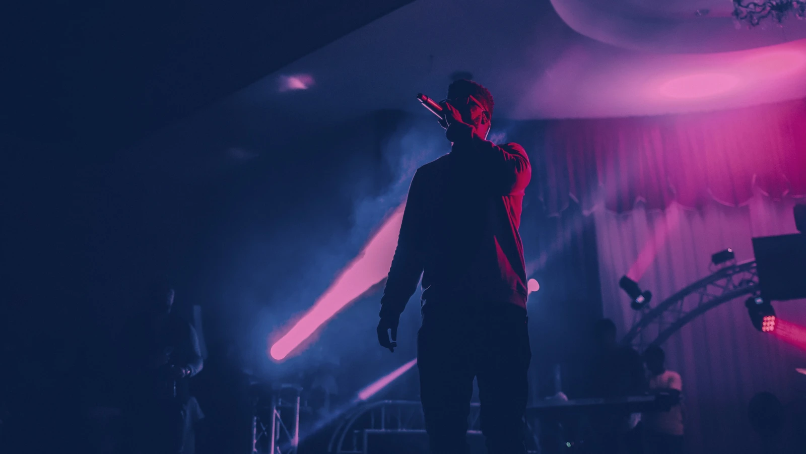 Hot Giggity gig booking platform showing a live performance on stage